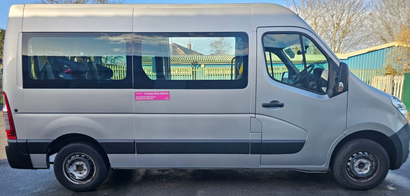Silver minibus side view